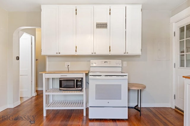 209 N 3rd, Bozeman, MT 59715 - kitchen featuring white electric range oven, stainless steel microwave, dark wood-style flooring, arched walkways, and white cabinetry