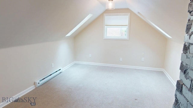 209 N 3rd, Bozeman, MT 59715 - bonus room with a baseboard heating unit, carpet floors, vaulted ceiling, a skylight, and baseboards