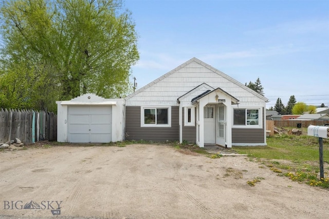 2422 Pine St, Butte, MT 59701 - view of front of property with a garage and dirt driveway