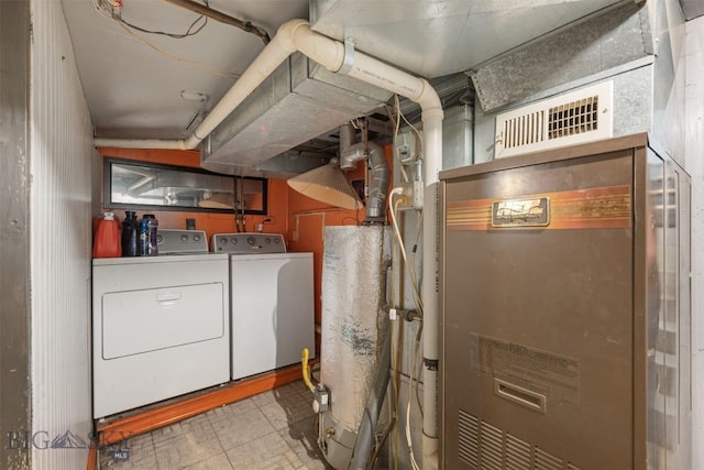 2422 Pine St, Butte, MT 59701 - unfinished below grade area featuring separate washer and dryer and tile patterned floors