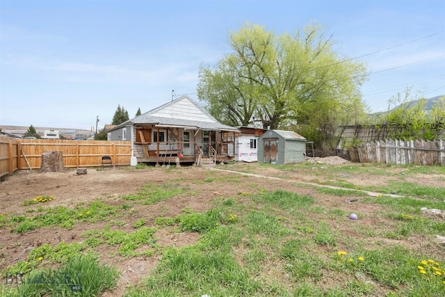 2422 Pine St, Butte, MT 59701 - rear view of property with covered porch and a fenced backyard