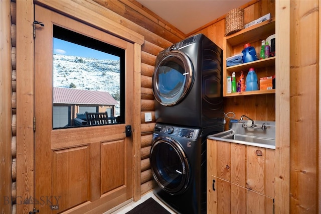 198 E River Rd, Emigrant, MT 59027 - laundry area with log walls, stacked washer / dryer, wet bar, and a mountain view