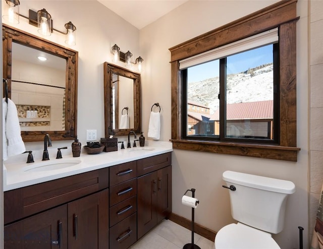 198 E River Rd, Emigrant, MT 59027 - full bathroom featuring double vanity, toilet, tile patterned floors, a shower with curtain, and baseboards