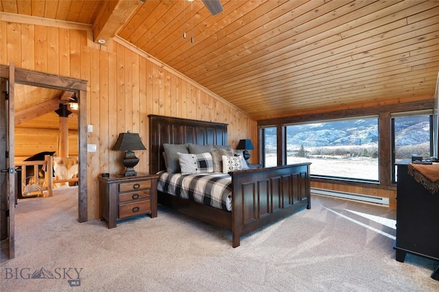 198 E River Rd, Emigrant, MT 59027 - bedroom with vaulted ceiling, baseboard heating, wood ceiling, wooden walls, and carpet