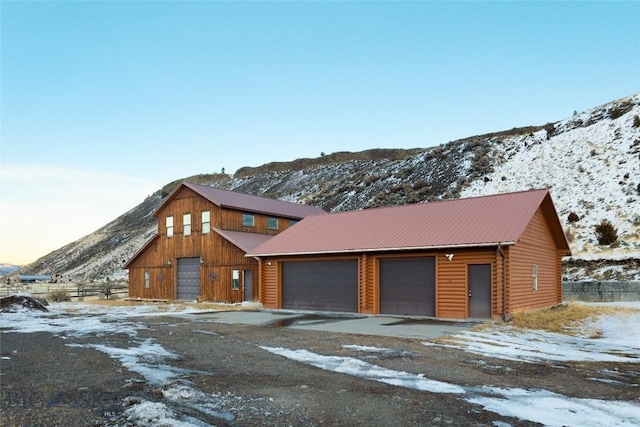 198 E River Rd, Emigrant, MT 59027 - snow covered garage featuring a mountain view