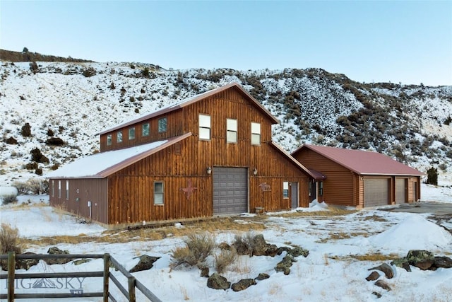 198 E River Rd, Emigrant, MT 59027 - view of front of home featuring a garage and an outbuilding