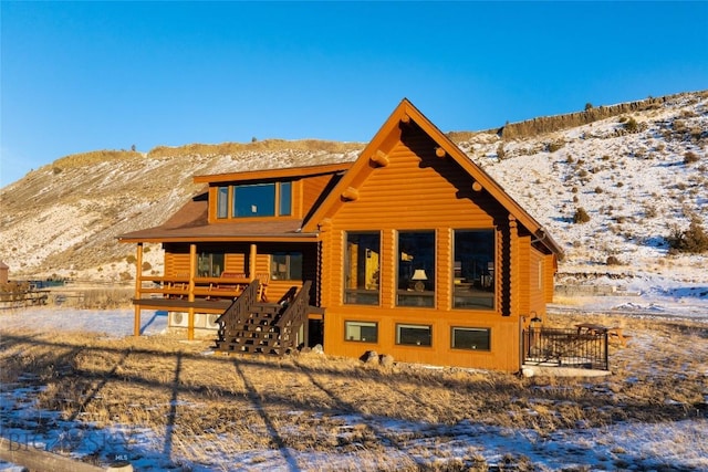 198 E River Rd, Emigrant, MT 59027 - snow covered back of property with a mountain view and stairs