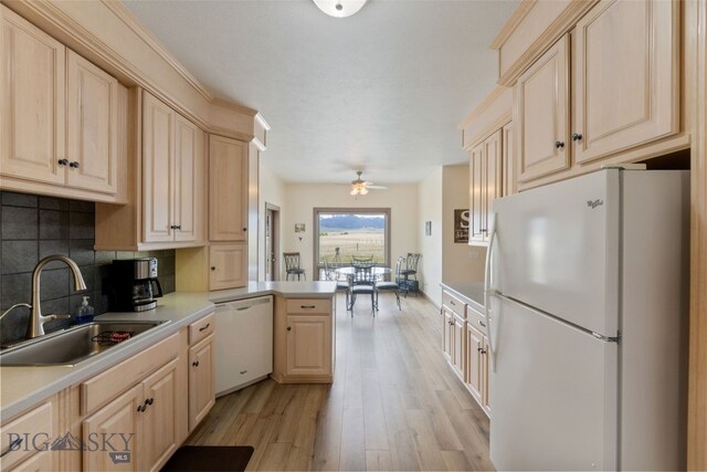 106 Lonesome Dove Rd, Cameron, MT 59720 - kitchen with white appliances, a sink, light brown cabinets, and light wood-style flooring