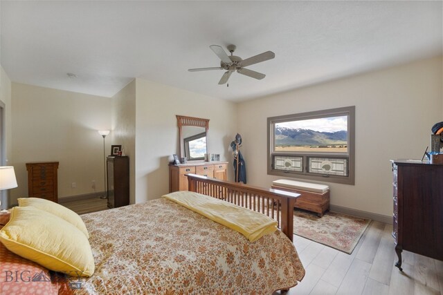 106 Lonesome Dove Rd, Cameron, MT 59720 - bedroom with light wood-type flooring, baseboards, and ceiling fan