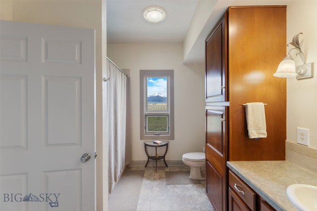 106 Lonesome Dove Rd, Cameron, MT 59720 - full bathroom with vanity, toilet, baseboards, tile patterned flooring, and a shower with shower curtain