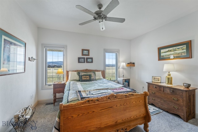 106 Lonesome Dove Rd, Cameron, MT 59720 - carpeted bedroom featuring a ceiling fan and baseboards