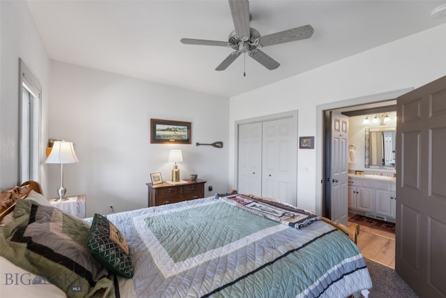106 Lonesome Dove Rd, Cameron, MT 59720 - bedroom featuring light wood-type flooring, a closet, ensuite bath, a ceiling fan, and a sink