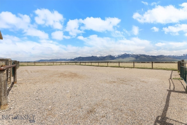 106 Lonesome Dove Rd, Cameron, MT 59720 - view of yard featuring a mountain view, a view of countryside, and an enclosed riding area