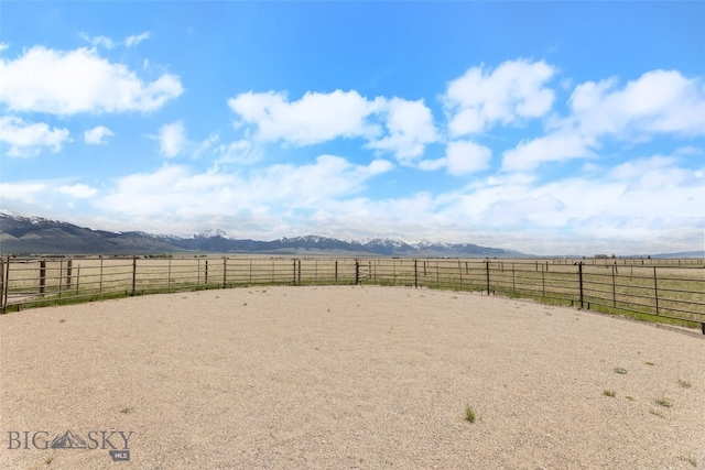 106 Lonesome Dove Rd, Cameron, MT 59720 - view of yard featuring a mountain view, an enclosed riding area, and a view of countryside