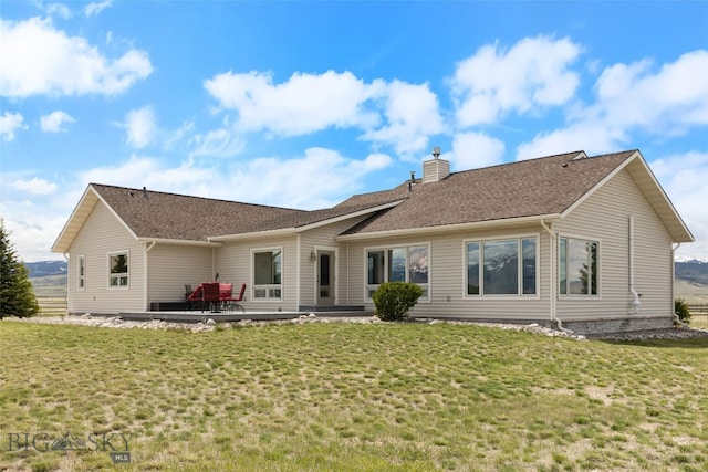 106 Lonesome Dove Rd, Cameron, MT 59720 - rear view of house featuring a chimney, a patio area, and a lawn