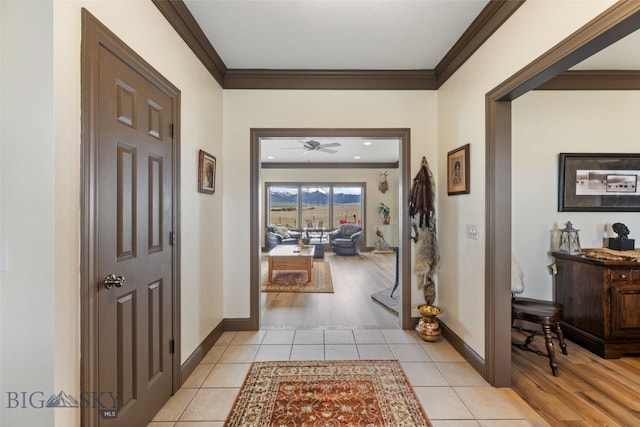 106 Lonesome Dove Rd, Cameron, MT 59720 - foyer with crown molding, a ceiling fan, light tile patterned floors, and baseboards