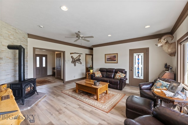 106 Lonesome Dove Rd, Cameron, MT 59720 - living area with a wood stove, crown molding, a ceiling fan, light wood-style floors, and recessed lighting