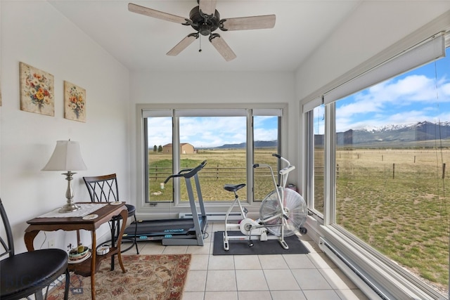 106 Lonesome Dove Rd, Cameron, MT 59720 - exercise room featuring light tile patterned flooring, a mountain view, a ceiling fan, baseboard heating, and a view of rural / pastoral area
