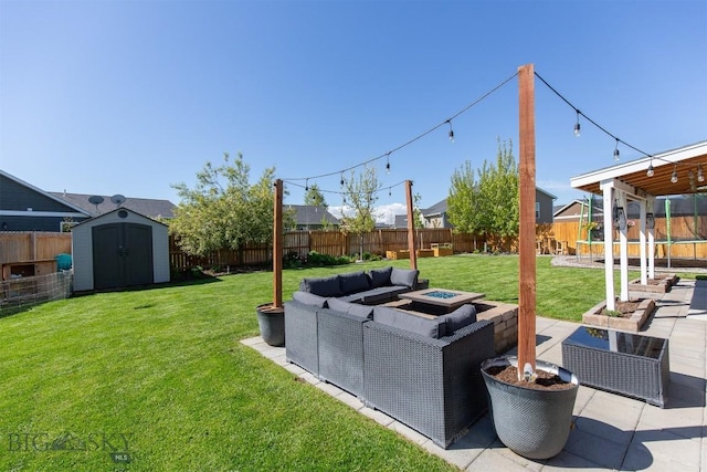 2008 Avocet Ct, Belgrade, MT 59714 - view of yard with an outdoor living space with a fire pit and a patio area