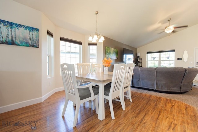 2008 Avocet Ct, Belgrade, MT 59714 - dining space with a chandelier, wood finished floors, baseboards, lofted ceiling, and a ceiling fan