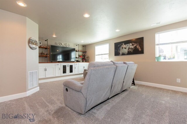 2008 Avocet Ct, Belgrade, MT 59714 - living room featuring light carpet, baseboards, and recessed lighting