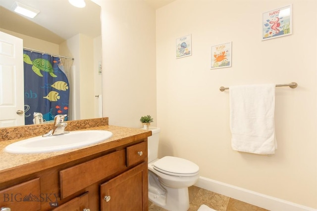 2008 Avocet Ct, Belgrade, MT 59714 - full bathroom with vanity, toilet, baseboards, and tile patterned flooring