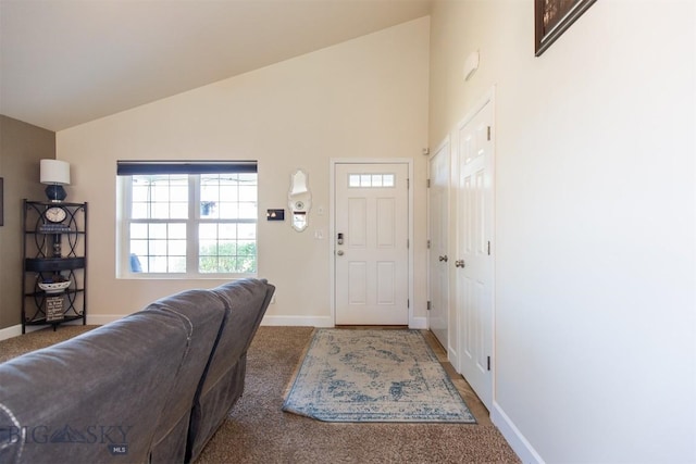 2008 Avocet Ct, Belgrade, MT 59714 - carpeted foyer entrance with baseboards, plenty of natural light, and high vaulted ceiling