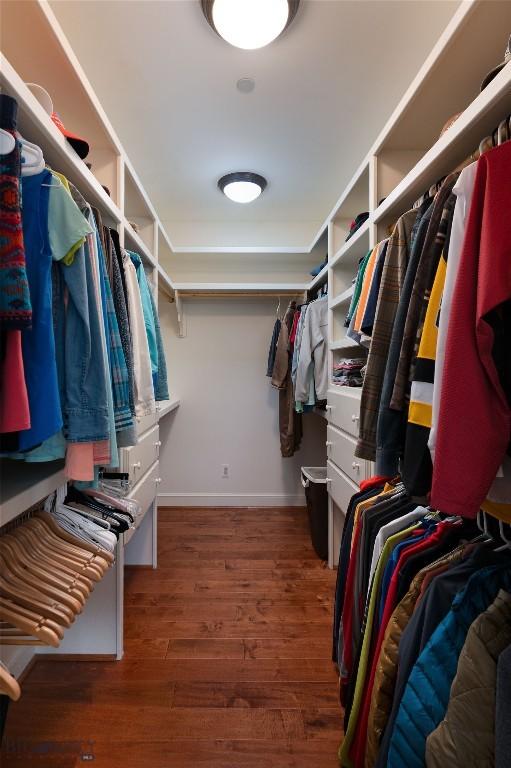 250 Petes Way, Big Sky, MT 59730 - walk in closet featuring wood finished floors