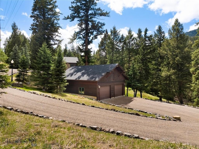 250 Petes Way, Big Sky, MT 59730 - view of property exterior featuring a garage and an outdoor structure