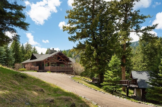 250 Petes Way, Big Sky, MT 59730 - view of front of property with dirt driveway and a deck