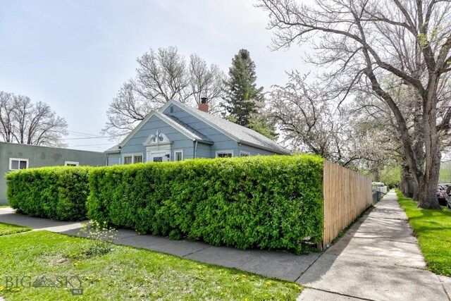 923 W Clark St, Livingston, MT 59047 - view of property exterior with a chimney