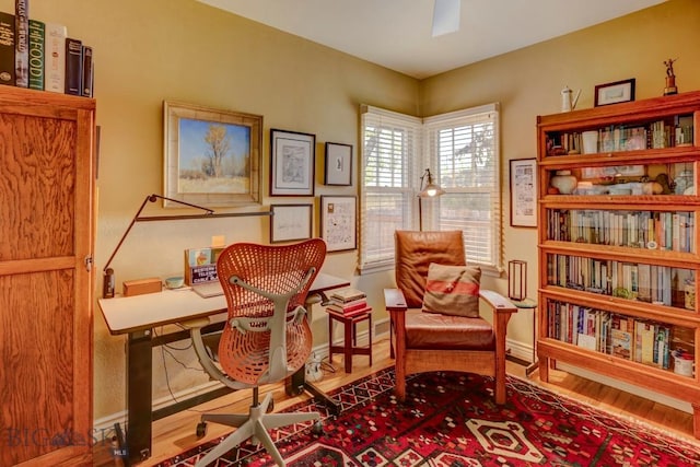 923 W Clark St, Livingston, MT 59047 - living area with wood finished floors, a desk, baseboards, and a ceiling fan
