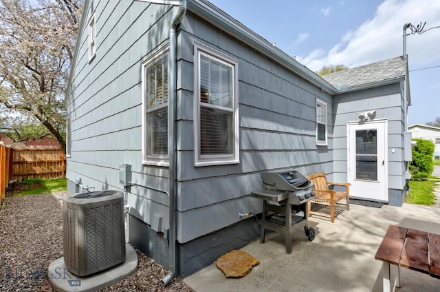 923 W Clark St, Livingston, MT 59047 - view of side of home with a patio area and central air condition unit