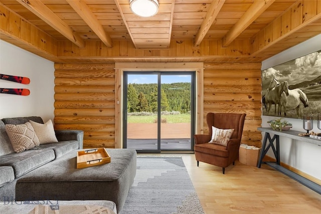 1266 Ousel Falls Rd, Big Sky, MT 59716 - living room with rustic walls, wooden ceiling with exposed beams, and light wood-style flooring