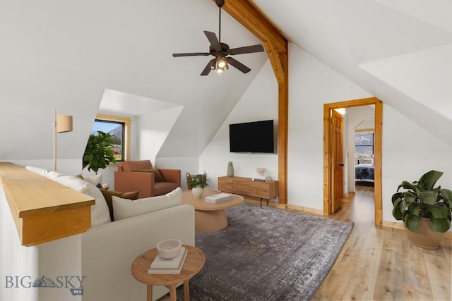 1266 Ousel Falls Rd, Big Sky, MT 59716 - living area with hardwood / wood-style floors, plenty of natural light, and a ceiling fan