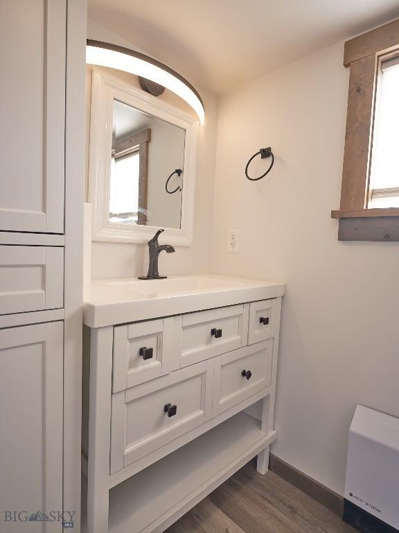 2178 Little Bear Rd, Gallatin Gateway, MT 59730 - bathroom with vanity, wood finished floors, and baseboards
