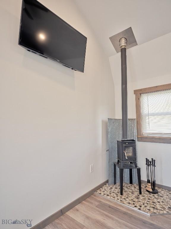 2178 Little Bear Rd, Gallatin Gateway, MT 59730 - detailed view of a wood stove, wood finished floors, and baseboards