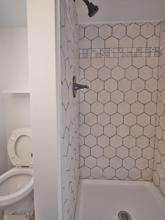 2178 Little Bear Rd, Gallatin Gateway, MT 59730 - full bathroom featuring toilet and a stall shower