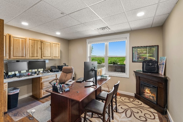 145 Cushing Ln, Manhattan, MT 59741 - office space featuring a drop ceiling, baseboards, built in desk, light wood-style floors, and recessed lighting