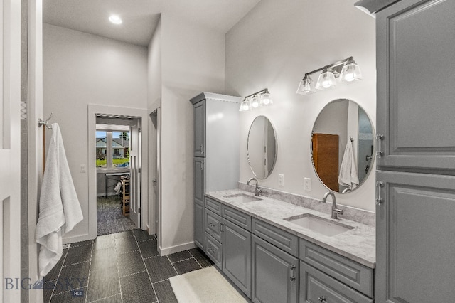 145 Cushing Ln, Manhattan, MT 59741 - bathroom with double vanity, baseboards, and recessed lighting
