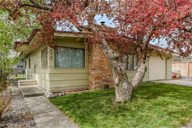 425 N 7th St, Livingston, MT 59047 - view of property hidden behind natural elements featuring concrete driveway and an attached garage