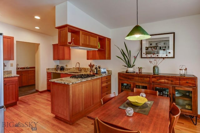 425 N 7th St, Livingston, MT 59047 - kitchen featuring a sink, stainless steel gas cooktop, light wood finished floors, light stone countertops, and recessed lighting