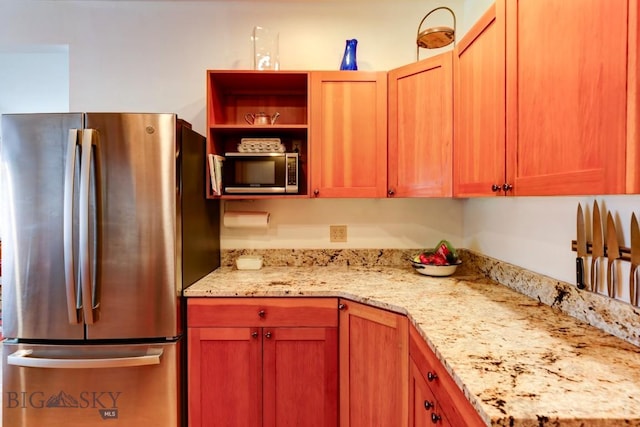 425 N 7th St, Livingston, MT 59047 - kitchen with stainless steel appliances and light stone countertops