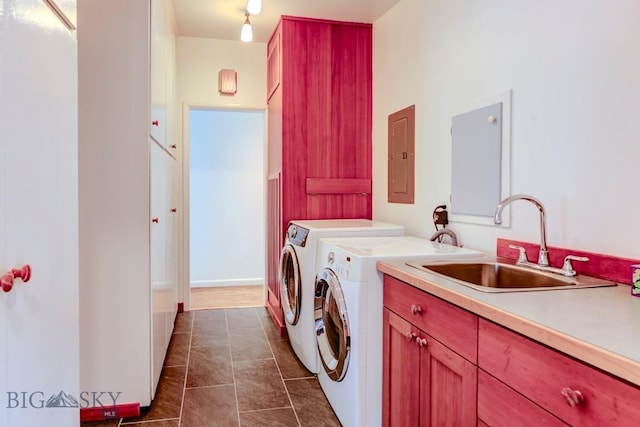 425 N 7th St, Livingston, MT 59047 - laundry area featuring electric panel, washing machine and dryer, cabinet space, and dark tile patterned flooring
