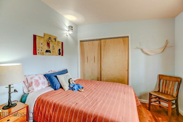 425 N 7th St, Livingston, MT 59047 - bedroom featuring wood finished floors, a closet, and baseboards