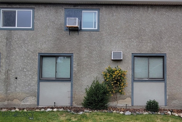 425 N 7th St, Livingston, MT 59047 - view of property exterior featuring stucco siding and a wall mounted AC