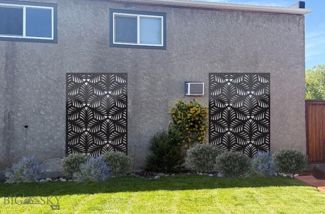 425 N 7th St, Livingston, MT 59047 - view of side of home featuring stucco siding