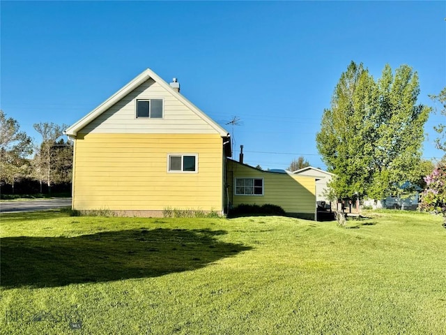 15 S Colorado St, Dillon, MT 59725 - view of side of home featuring a yard