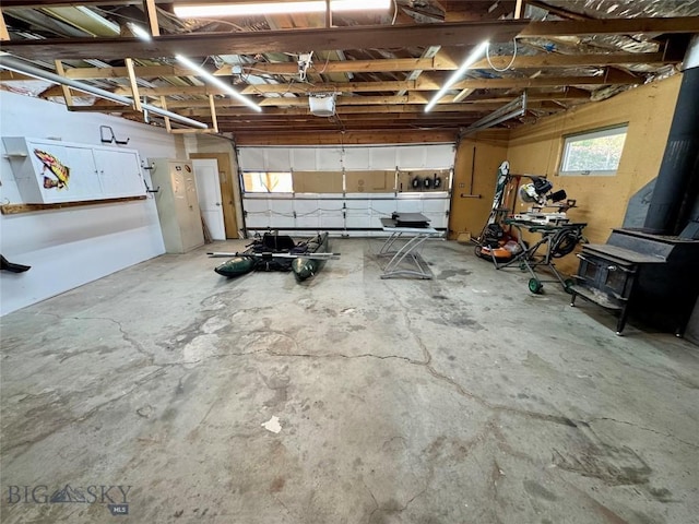 15 S Colorado St, Dillon, MT 59725 - garage with a garage door opener and a wood stove