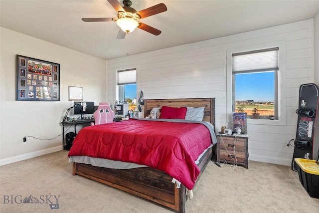 1711 Shelby Ave, Belgrade, MT 59714 - carpeted bedroom featuring baseboards, a ceiling fan, and wood walls